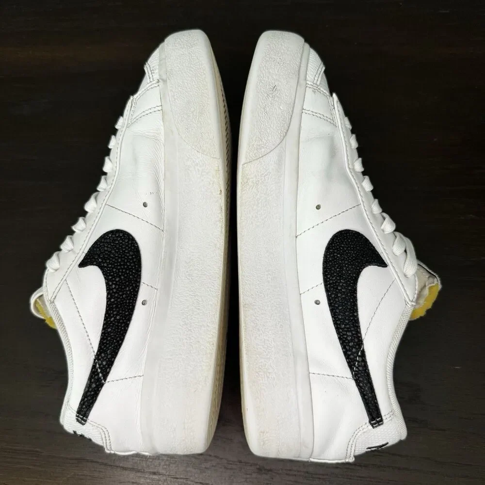 Nike White Leather Low-Top Sneakers with Black Swoosh and Yellow Tongue